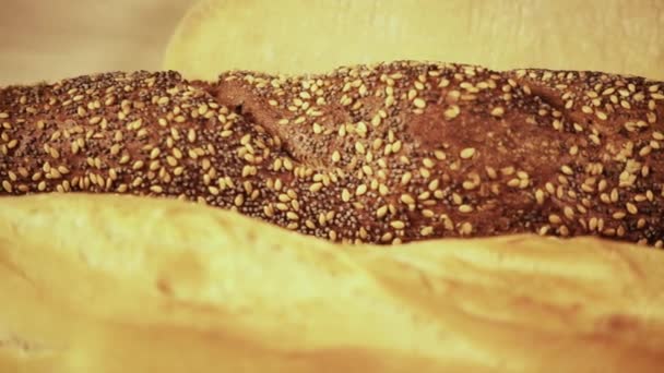 Rye bread with sesame seeds — Stock Video
