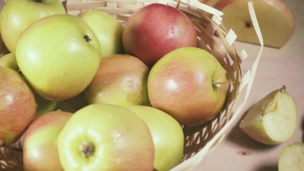 Wet apples in a basket near chopped and chips slow motion — Stock Video