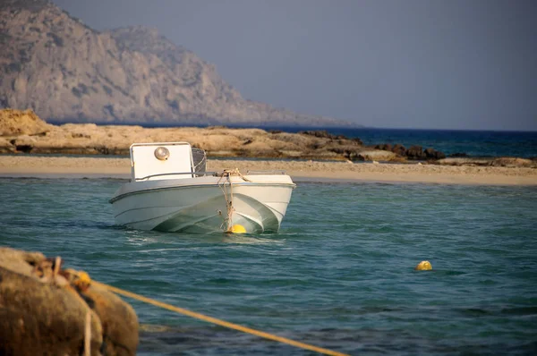 Sunset with a boat — Stock Photo, Image