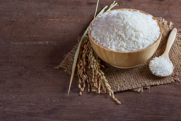 Jasmine rice in wooden bowl — Stock Photo, Image