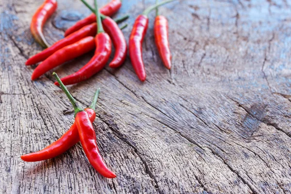 Fresh red chili on an old wooden background. — Stock Photo, Image