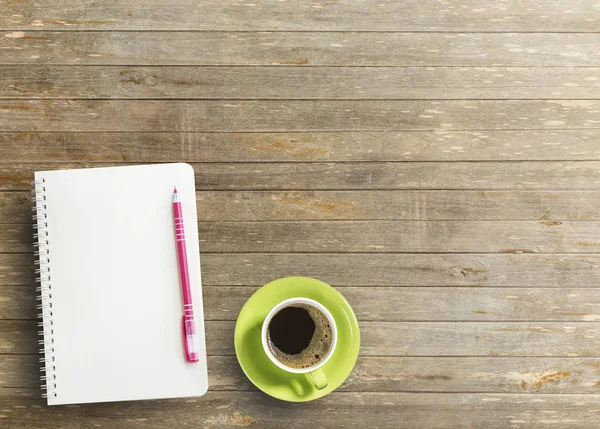 Office desk with notebook and coffee — Stock Photo, Image