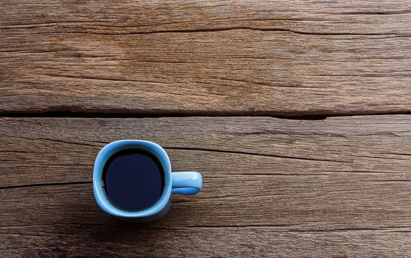 Coffee cup on wooden table background — Stock Photo, Image