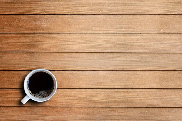 Coffee cup on wooden table top view — Stock Photo, Image