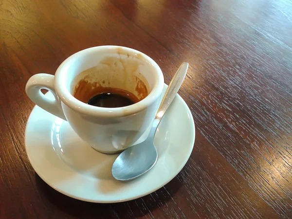 Cup of coffee on wooden table — Stock Photo, Image