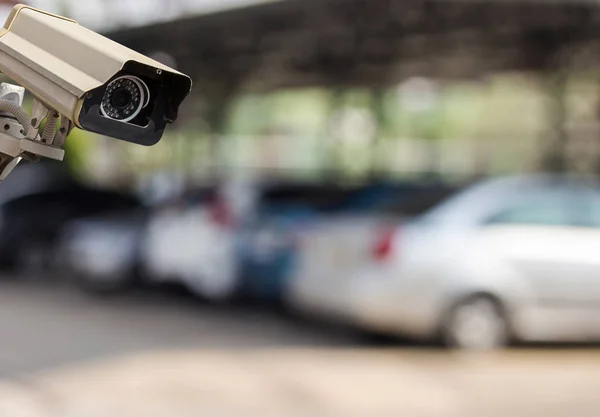 CCTV security camera on blur car parking — Stock Photo, Image