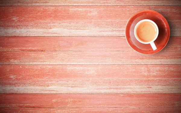 Red coffee cup on old wood background — Stock Photo, Image