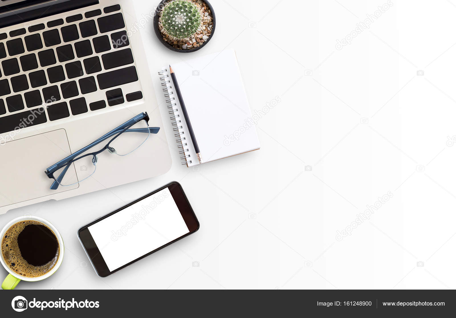 White Office Desk Table With Laptop Computer And Smart Phone