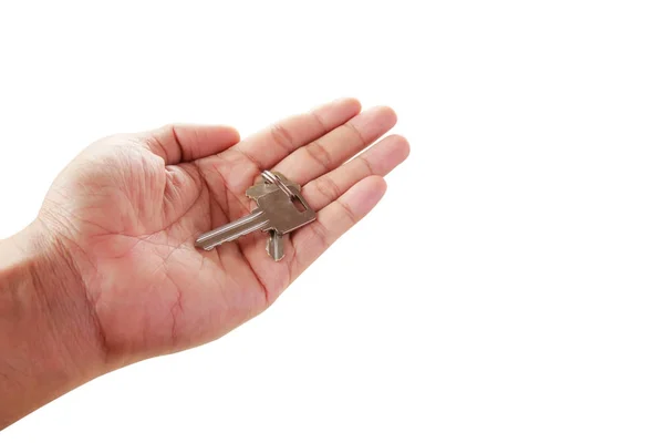 Human hand holding key to a dream house isolated on white — Zdjęcie stockowe