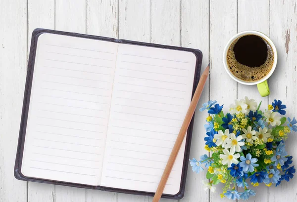 Top view of office desk table with open spiral notebook — Stock Photo, Image