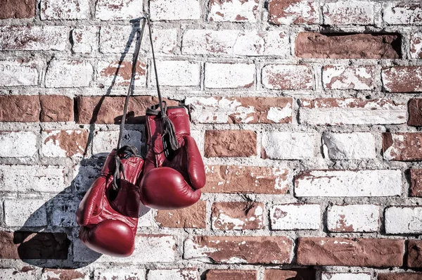 boxing gloves on the brick wall. Vintage image