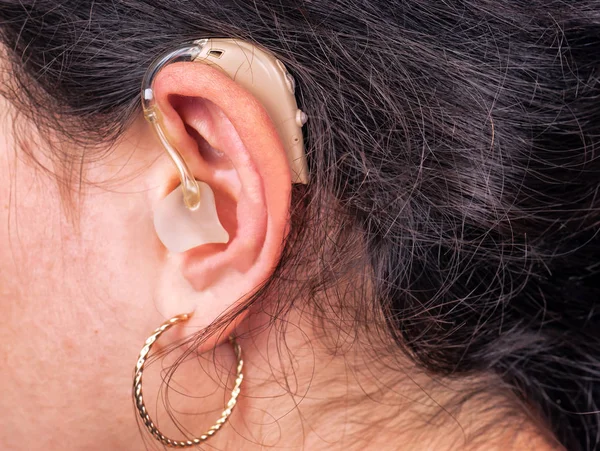 woman ear with hearing aid