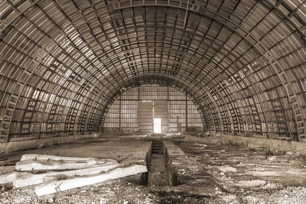 empty abandoned hangar in monochrome