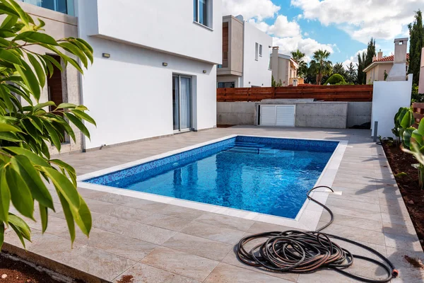 pool with blue water in the yard