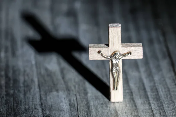 Wooden cross with shadow — Stock Photo, Image