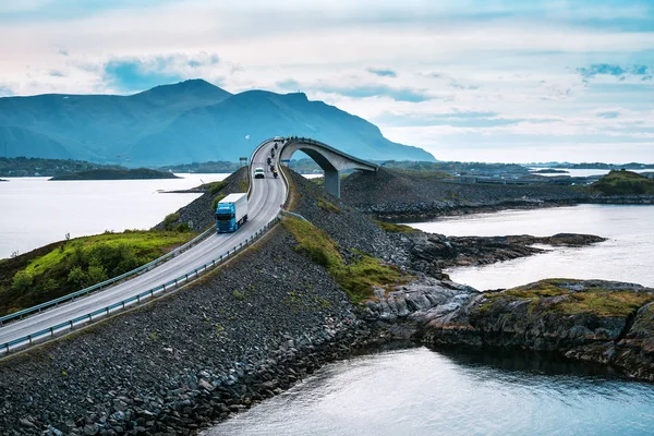 Cars and motorcycles ride over the bridge — стоковое фото