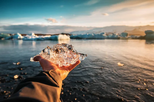 Crystal of ice in human hand — Stok fotoğraf