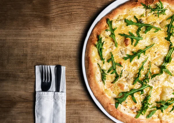 Pizza with cheese and green arugula —  Fotos de Stock