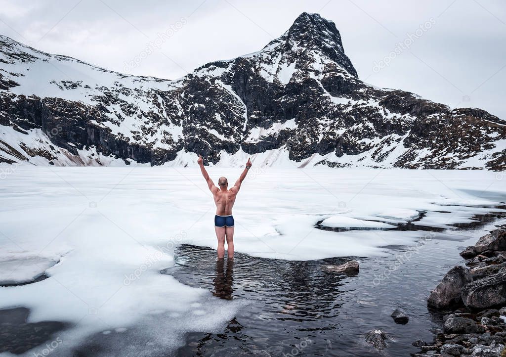 naked happy, walrus man on a frozen lake in Norway