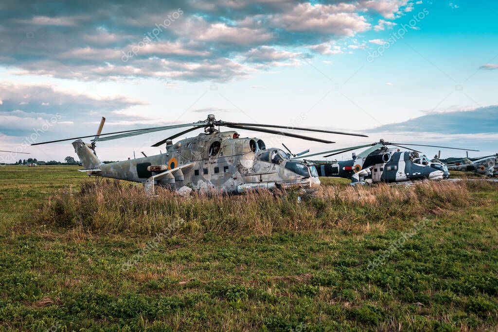 wrecks of military helicopters on the green grass