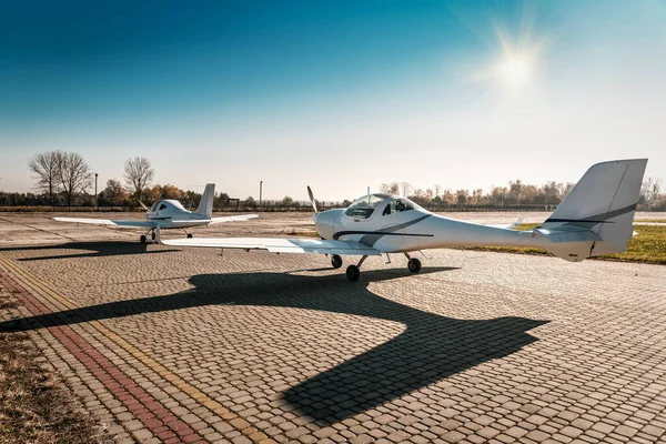 two small planes under blue sky