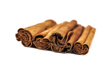 real cinnamon sticks isolated on white