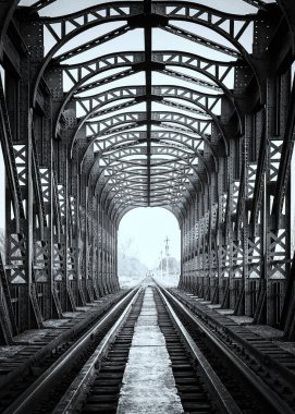 symmetry of old railway bridge in monochrome