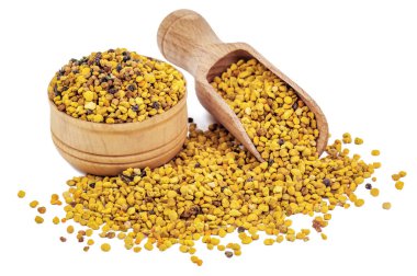bee pollen and wooden scoop isolated on white