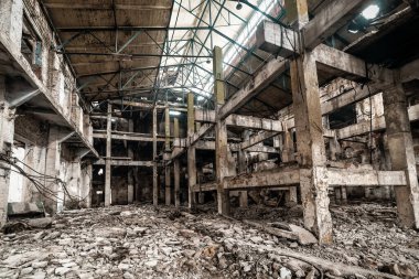ruins of abandoned factory interior and building waiting for a demolition.