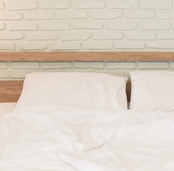 Unmade bed and Pillows — Stock Photo, Image