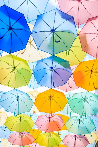 Colorful umbrellas under sky — Stock Photo, Image