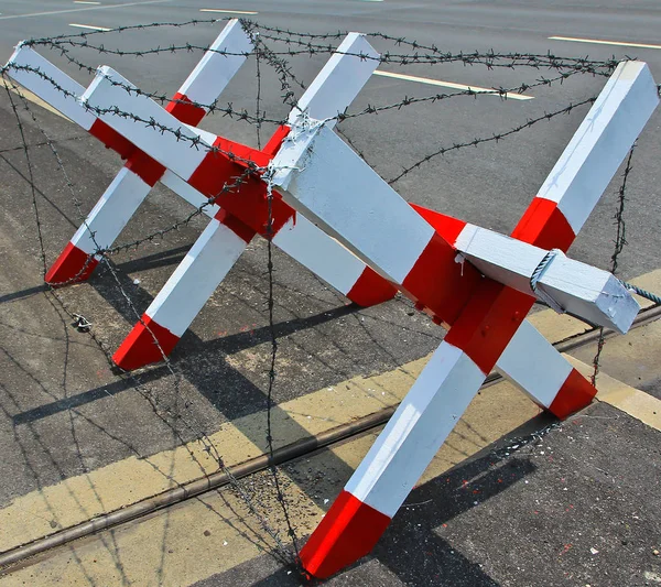 Barbed wire blocking road — Stock Photo, Image