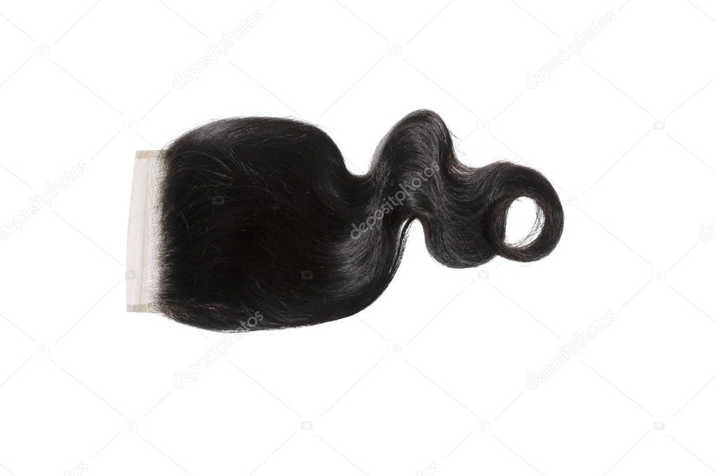 Body wave closure stock photo isolated on white background.   Black lace front hair bundle product shot. 100% virgin mink human hair extensions for sew in weaves.