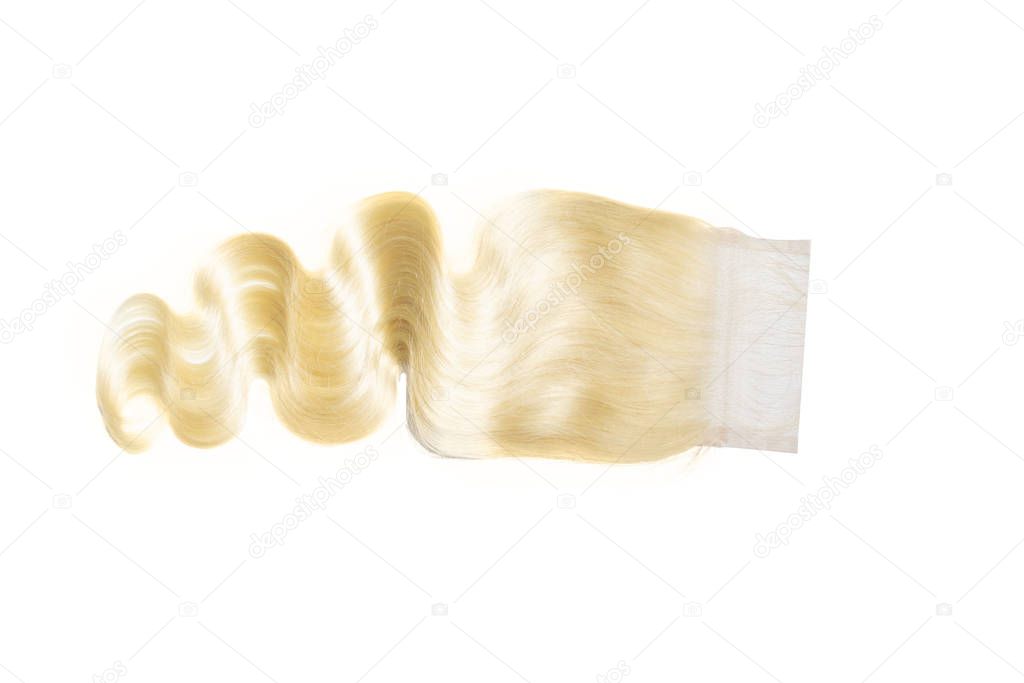 613 blonde body wave lace closure product stock photo, isolated on white background.   Virgin human hair extensions for sew ins and weaves.