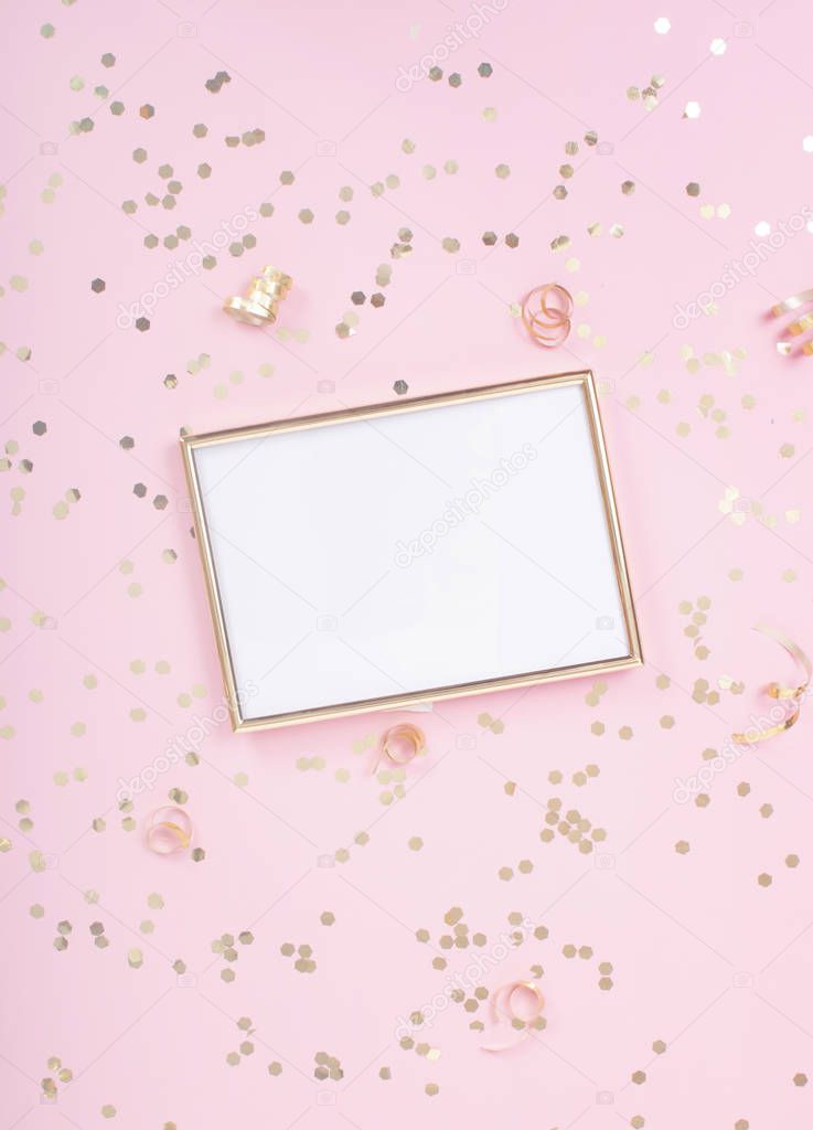 Gold 5x7 picture frame mock up on pink background with gold confetti around it.  Feminine styled stock photo.