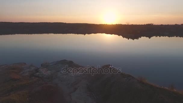 stock video Girl on the Lake at sunset