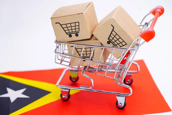 Box with shopping cart logo and East Timor flag : Import Export Shopping online or eCommerce finance delivery service store product shipping, trade, supplier concept