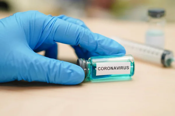 Novel Coronavirus (2019-nCoV) vaccine development medical with syringe for doctor use to treat pneumonia illness patients at Wuhan, China.
