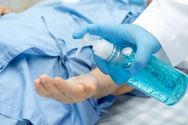 Doctor Holding Press Blue Alcohol Sanitizer Gel Senior Woman Patient — Stock Photo, Image