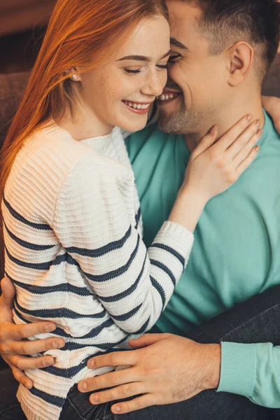 Red haired caucasian girl with freckles is held by her lover during a warm morning together — Stock Photo, Image