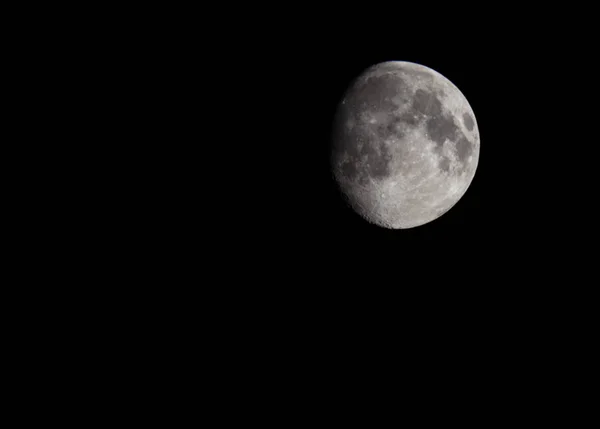 Photo of the Moon in the space on the black background isolated