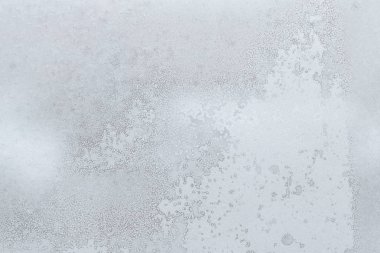 Pencerenin ayaz izi. Cam buza dokusuna.