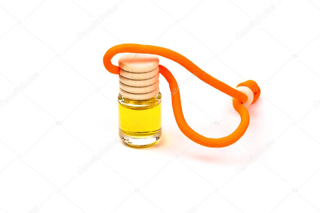 Air freshener bottle with wooden cap and orange cord close-up