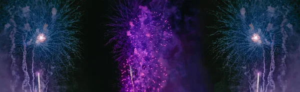 Purple and blue fireworks with smoke over the city sky — Stock Photo, Image