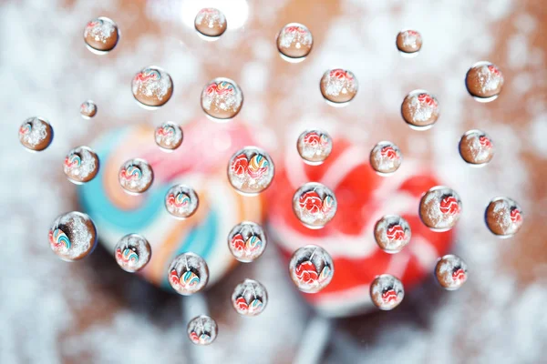 Candy heart shaped picture in water drops — Stock Photo, Image