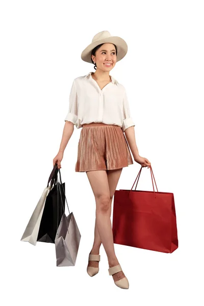 Šťastné ženy s nákupní taškou na bílém pozadí s clippin — Stock fotografie
