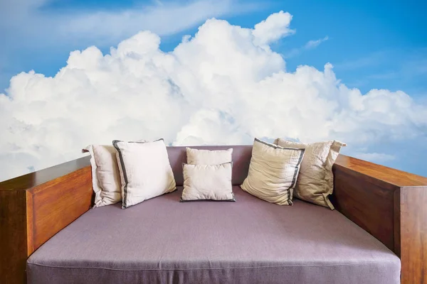 Leather sofa on big cloud backgroun — Stock Photo, Image