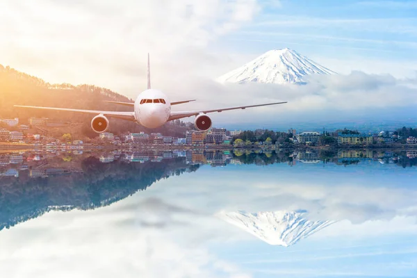 Airplane frying over the Snow Mountain Fuji background