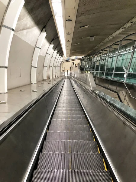 Escalator in metro. Moving down staircase Close up floor platfor