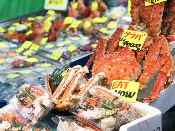 Giant fresh king crab seafood Street food in Tsukiji Fish Market, Japan